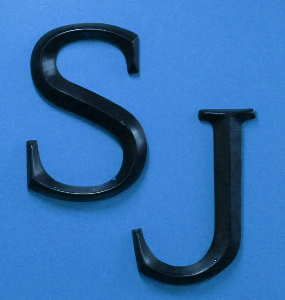 The Scissor Joint SJ logo on a blue background
